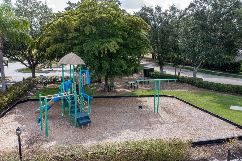1965 Crestview Way, Unit 156 Naples, FL 34119 - Photo 44 of 45 a view of a park with slide