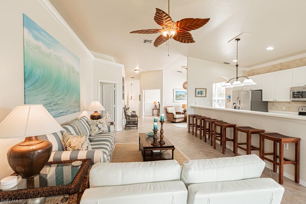 1965 Crestview Way, Unit 156 Naples, FL 34119 - Photo 8 of 45 a living room with furniture