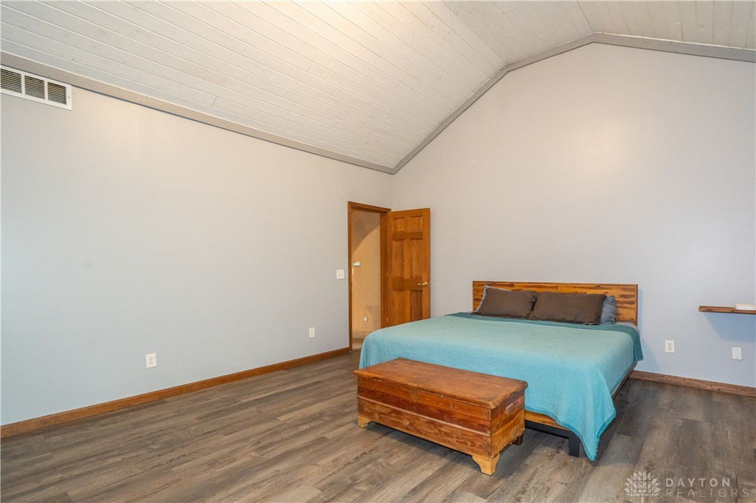 10584 New Biddinger Road Harrison, OH 45030 - Photo 29 of 61 This spacious bedroom offers high ceilings and durable flooring for comfortable living.