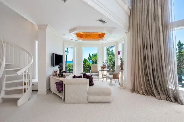 a spacious bedroom with two beds and a large window