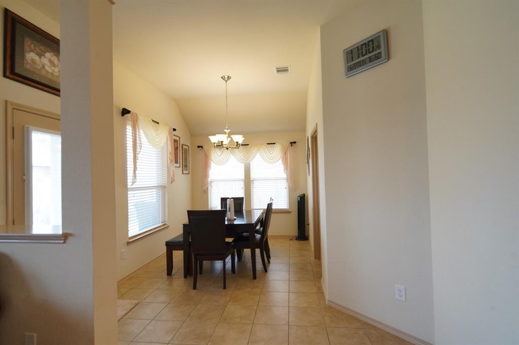 4508 Fox Rio Trail Arlington, TX 76017 - Photo 27 of 28 a view of a dining room with furniture