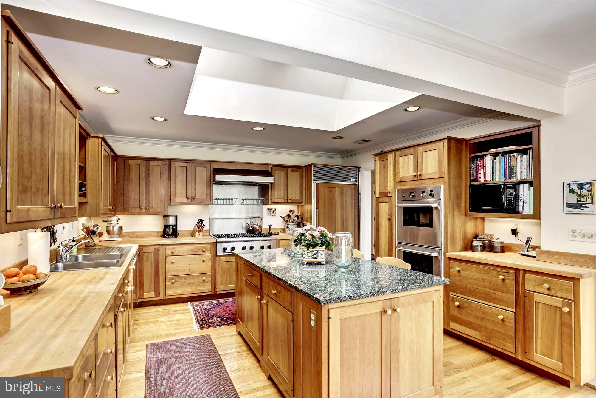 10820 Edison Road Potomac, MD 20854 - Photo 22 of 65 KITCHEN HAS SKYLIGHT & CENTER ISLAND WITH GRANITE