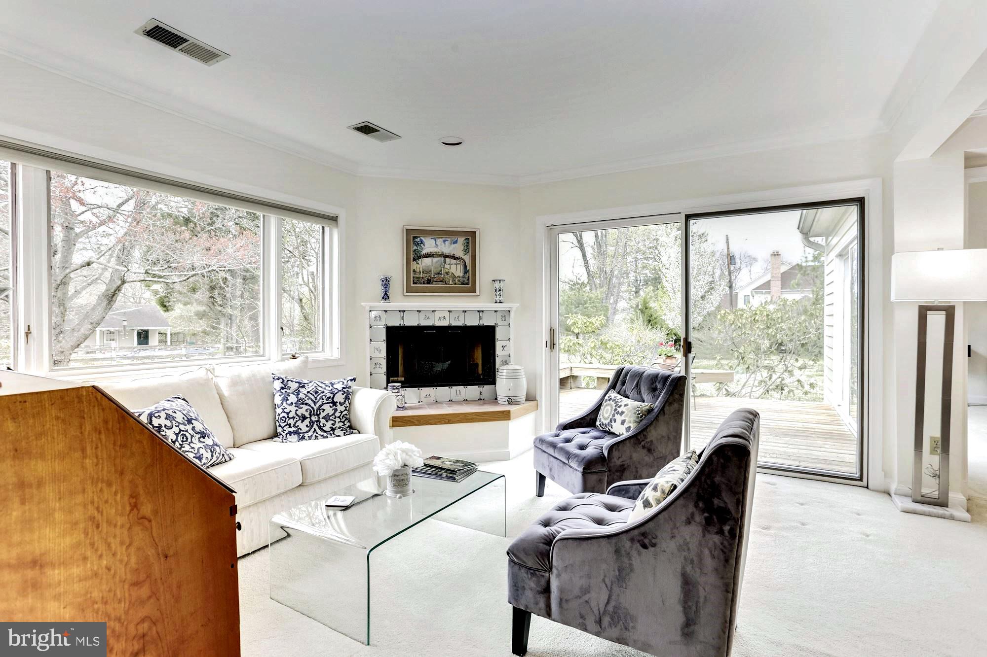 10820 Edison Road Potomac, MD 20854 - Photo 24 of 65 SITTING ROOM HAS PROPANE FIREPLACE & DECK ACCESS