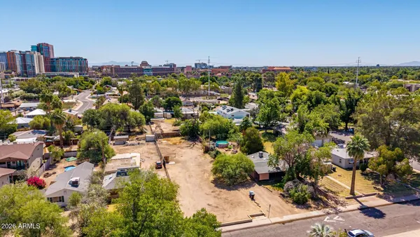 an aerial view of a city with lots of residential buildings