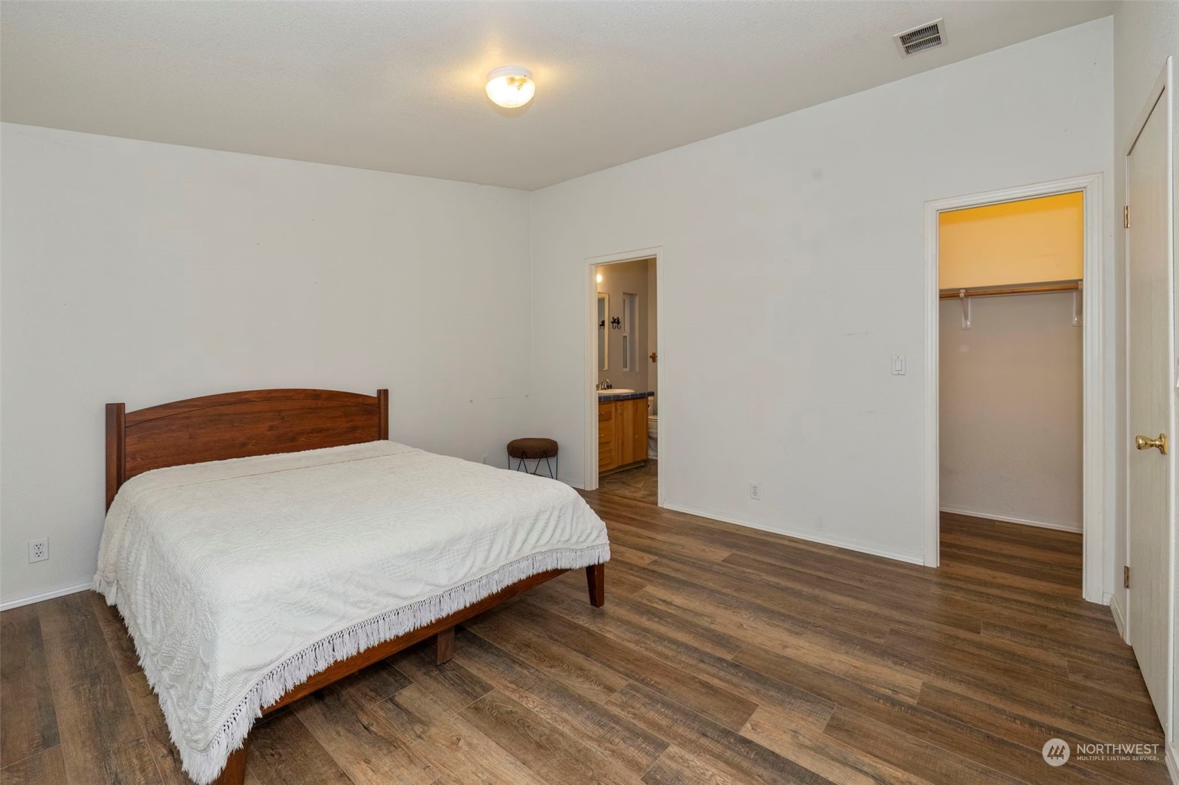 400 Lemmon Road Port Angeles, WA 98362 - Photo 10 of 24 a bedroom with a bed and wooden floor