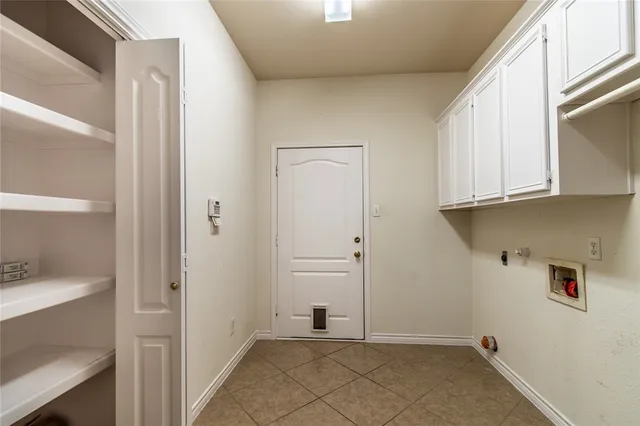 a view of a closet area with an empty room