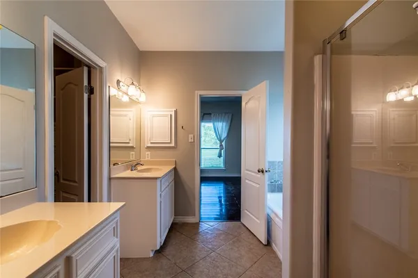 a view of a bathroom from a hallway
