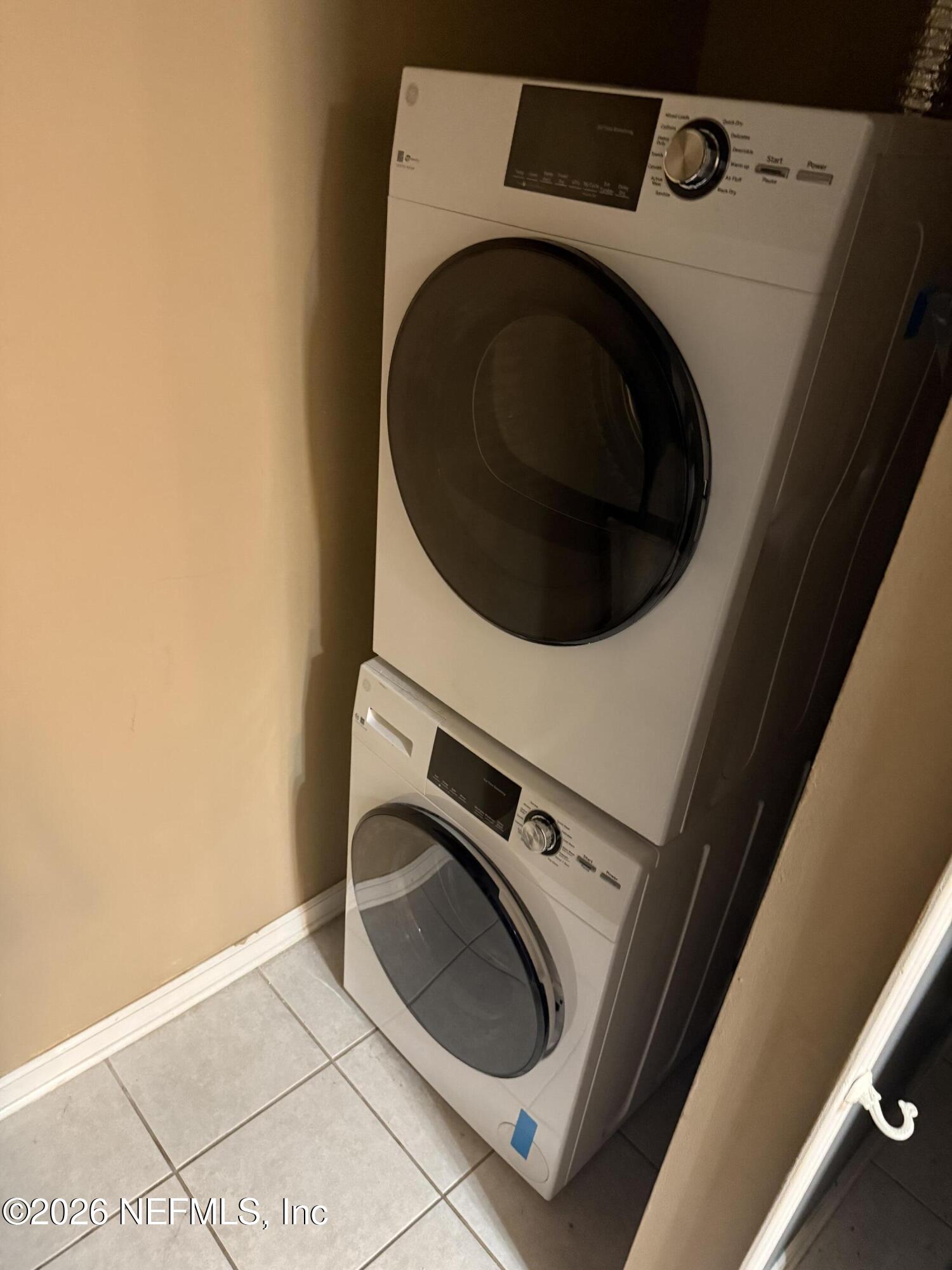 7920 Merrill Road, Unit 914 Jacksonville, FL 32277 - Photo 9 of 19 washer dryer off kitchen