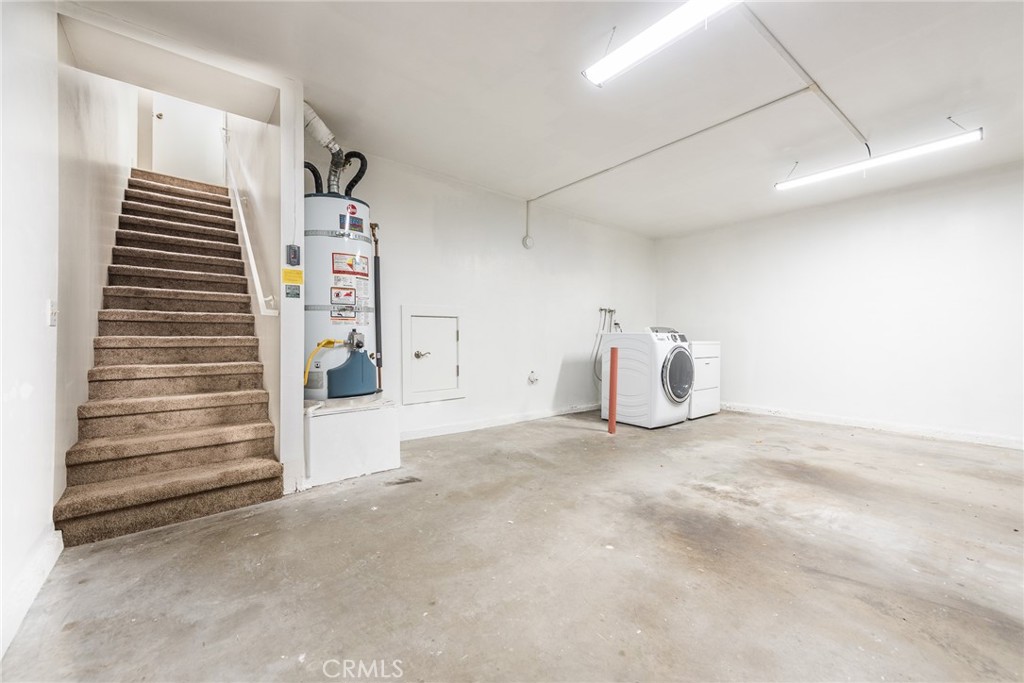 4679 Maxwell Court Riverside, CA 92501 - Photo 33 of 45 Garage with stairs leading up to second level