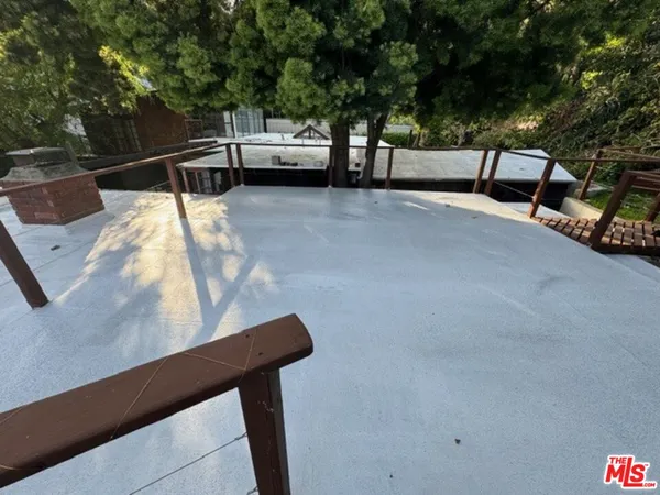 a view of a house with backyard and deck