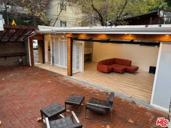 a view of small yard with wooden fence