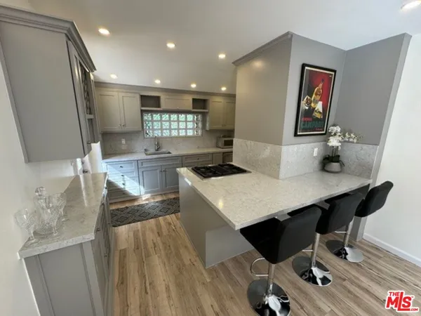a large kitchen with a table and chairs