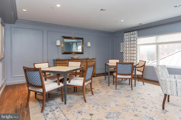 a dining room with furniture and window