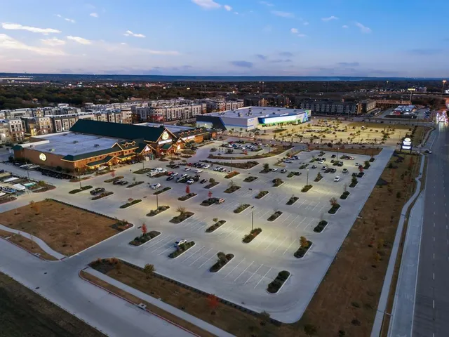 an aerial view of a pool table and chairs