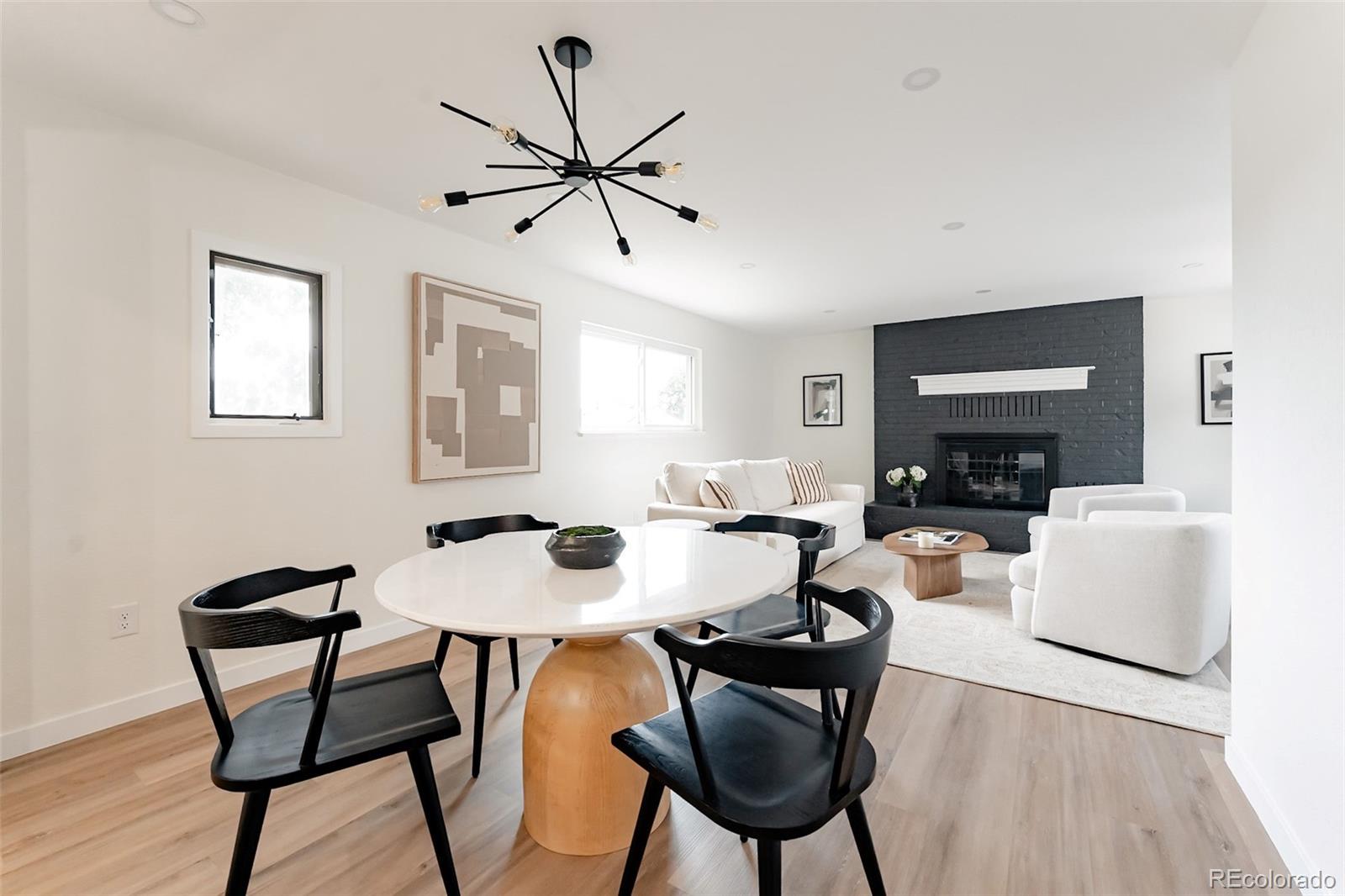 1279 South Raritan Street Denver, CO 80223 - Photo 5 of 25 a view of a dining room with furniture and wooden floor