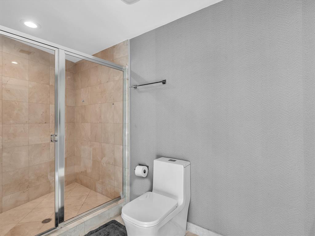 1600 South Ocean Boulevard, Unit 403 Pompano Beach, FL 33062 - Photo 23 of 52 a bathroom with a shower and a toilet