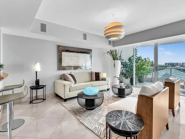 a kitchen with stainless steel appliances granite countertop a sink counter space cabinets and a large window