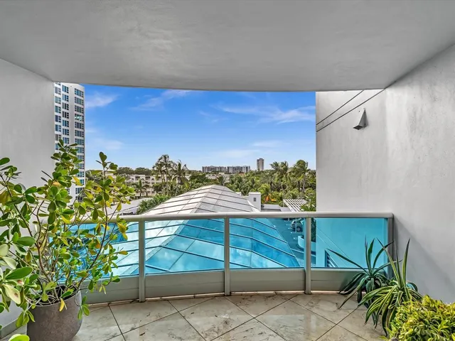a view of swimming pool with a yard and seating space