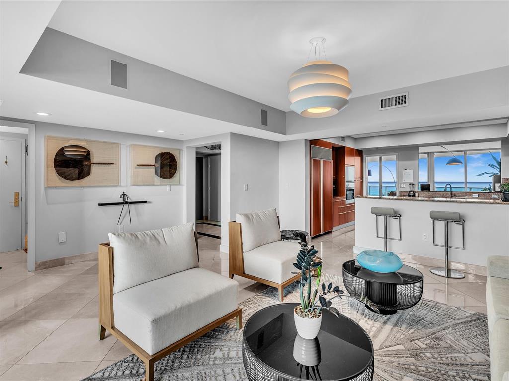 1600 South Ocean Boulevard, Unit 403 Pompano Beach, FL 33062 - Photo 38 of 52 a living room with furniture and kitchen view
