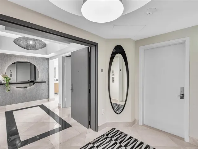a view of a dining room with furniture and window