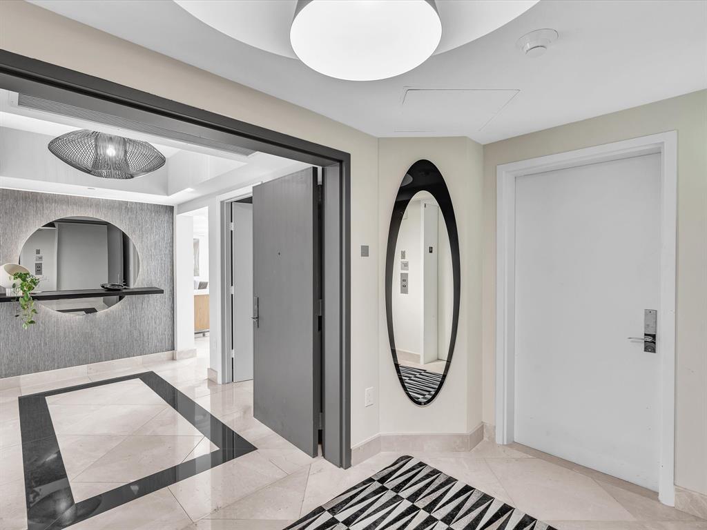 1600 South Ocean Boulevard, Unit 403 Pompano Beach, FL 33062 - Photo 5 of 52 a bathroom with a granite countertop sink and a mirror