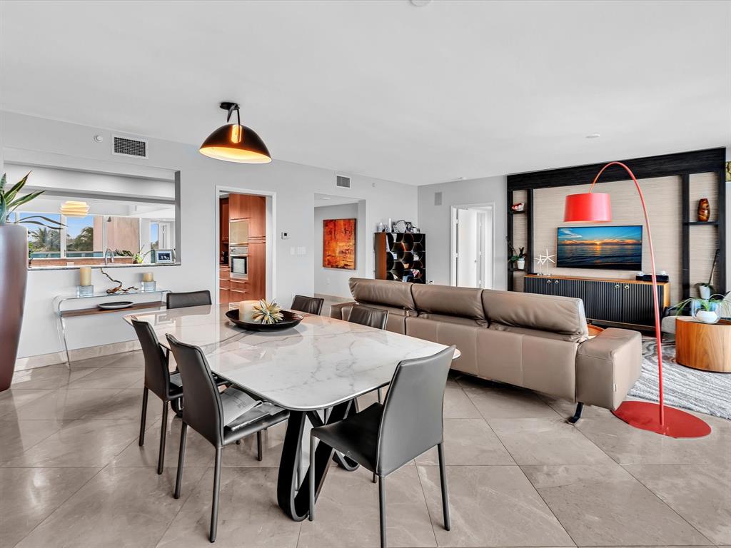 1600 South Ocean Boulevard, Unit 403 Pompano Beach, FL 33062 - Photo 9 of 52 a living room with furniture and a flat screen tv