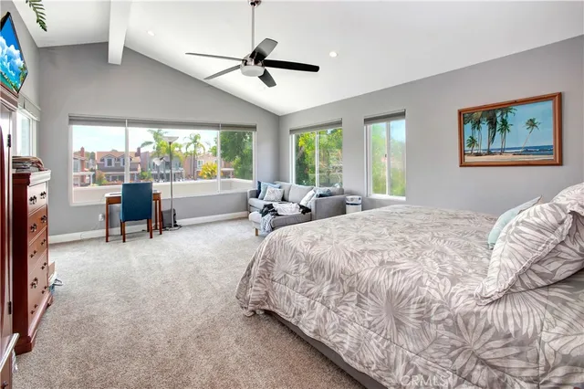 a bed room with a bed and a large window