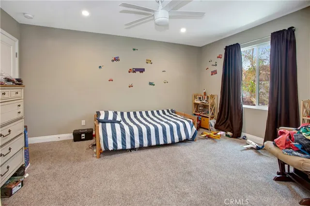 a bed room with a bed and a window