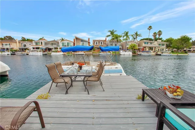 a view of a lake with outdoor seating