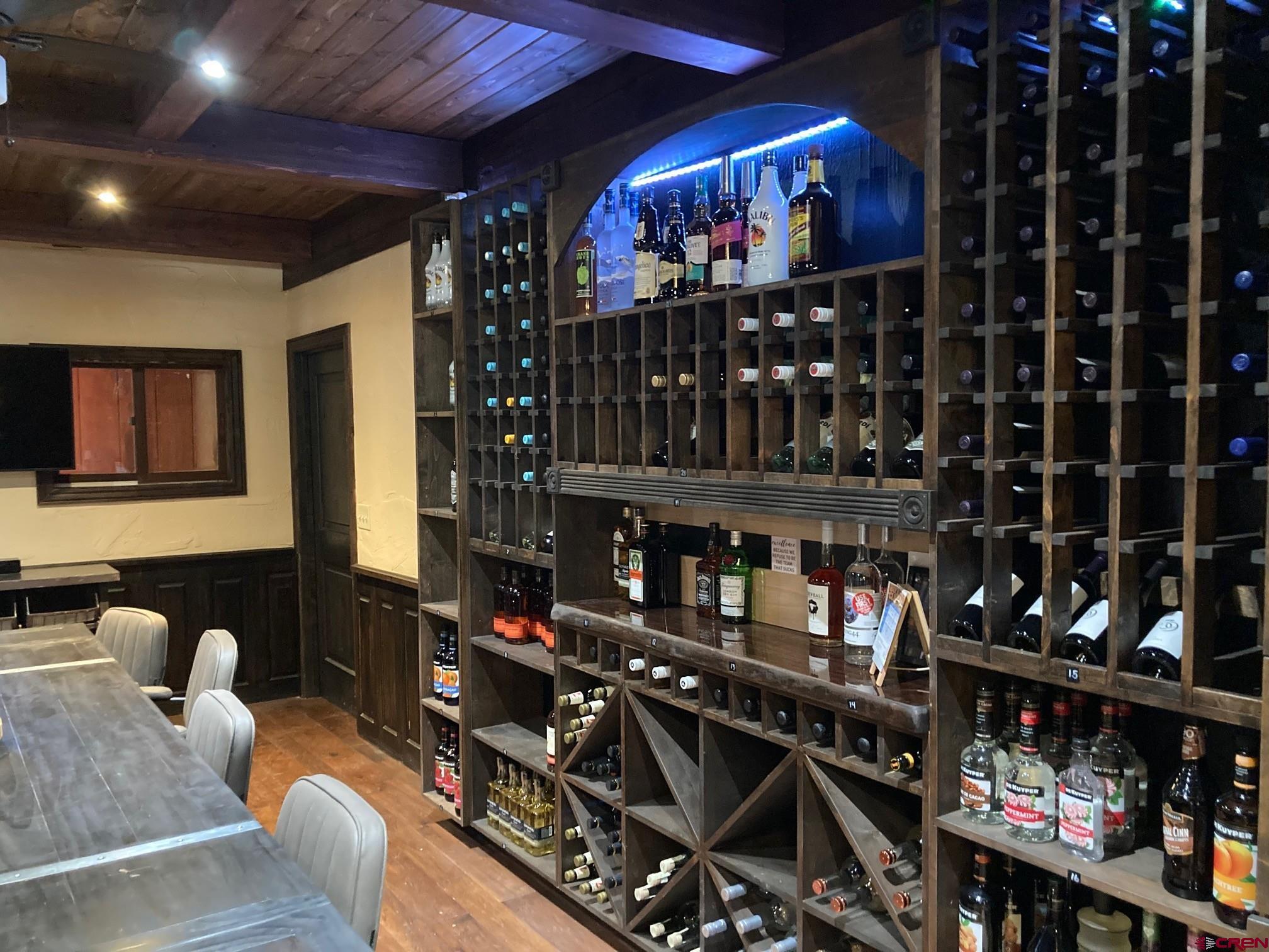 147 Ridge Road Cimarron, CO 81220 - Photo 26 of 36 a room with lots of wine cabinets