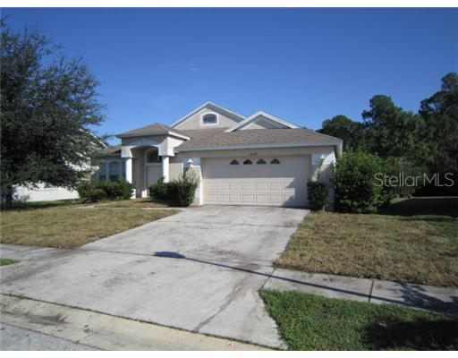 12542 Eclipse Court New Port Richey, FL 34654 - Photo 1 of 1 a front view of a house with a yard