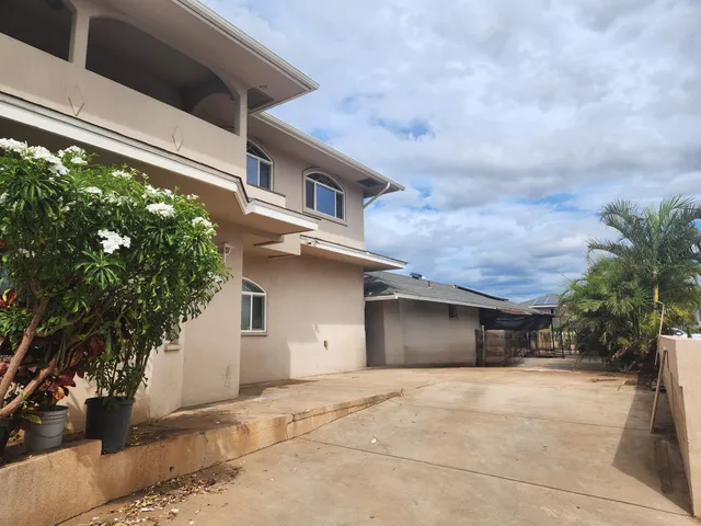 a kitchen with granite countertop cabinets stainless steel appliances and a sink