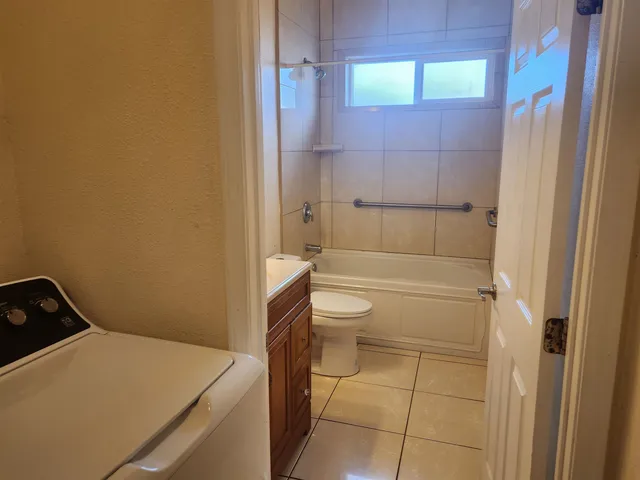 a bathroom with a toilet and shower