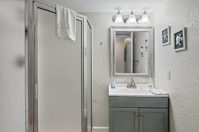 a bathroom with a sink and mirror