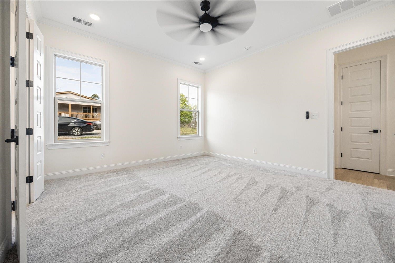 2939 Brighton-Clopton Road Brighton, TN 38011 - Photo 19 of 36 Spare room featuring ornamental molding, light carpet, ceiling fan, and recessed lighting