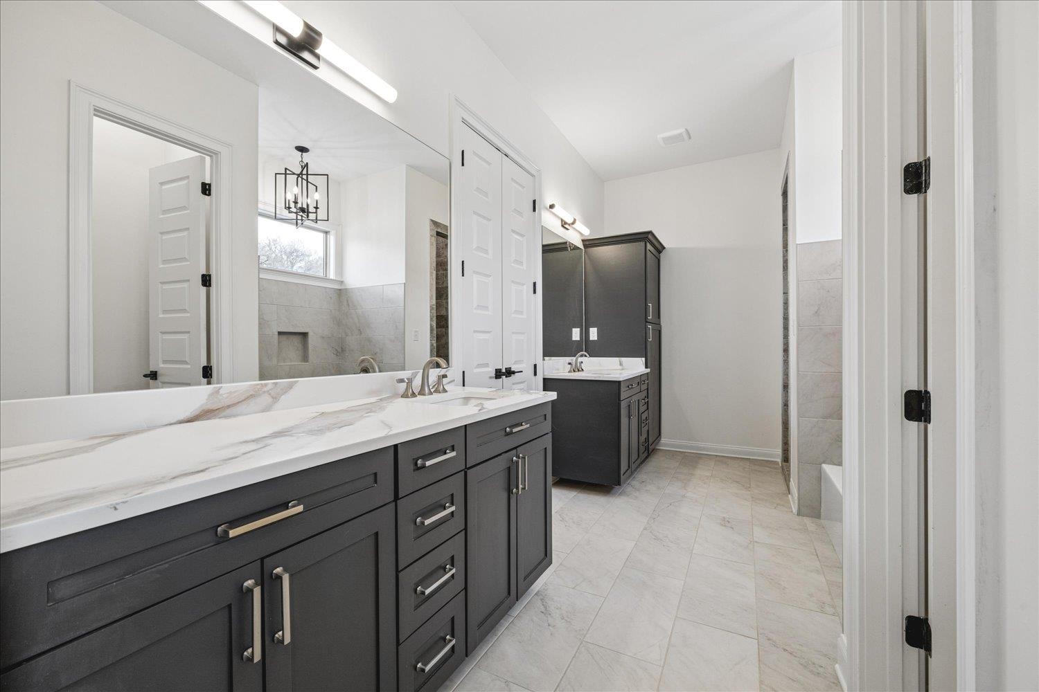 2939 Brighton-Clopton Road Brighton, TN 38011 - Photo 20 of 36 Bathroom with two vanities and a tub