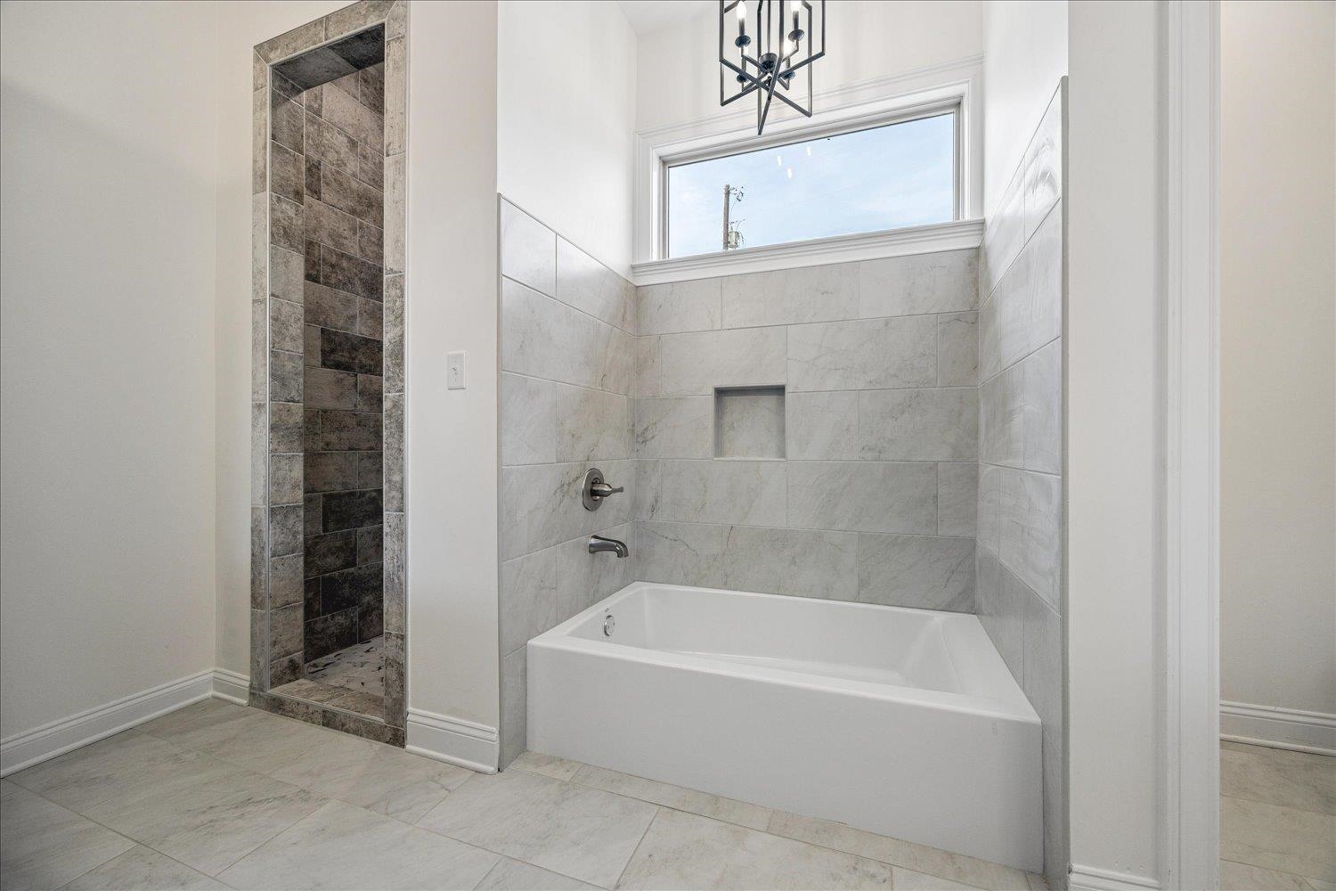 2939 Brighton-Clopton Road Brighton, TN 38011 - Photo 21 of 36 Bathroom featuring a garden tub and a walk in shower
