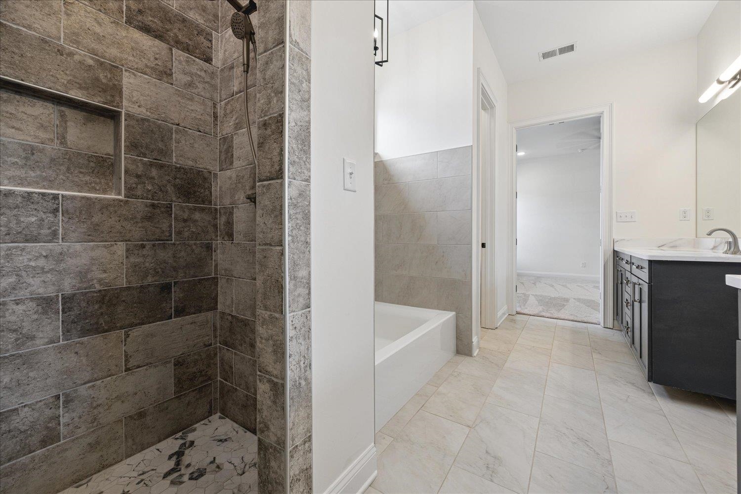 2939 Brighton-Clopton Road Brighton, TN 38011 - Photo 22 of 36 Full bath featuring vanity, a bath, and tiled shower