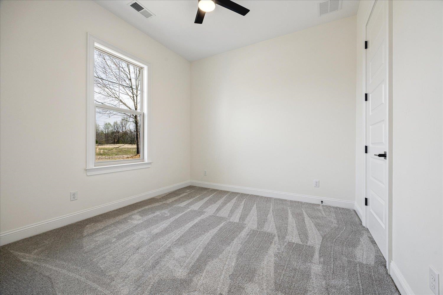 2939 Brighton-Clopton Road Brighton, TN 38011 - Photo 25 of 36 Empty room featuring light carpet and ceiling fan