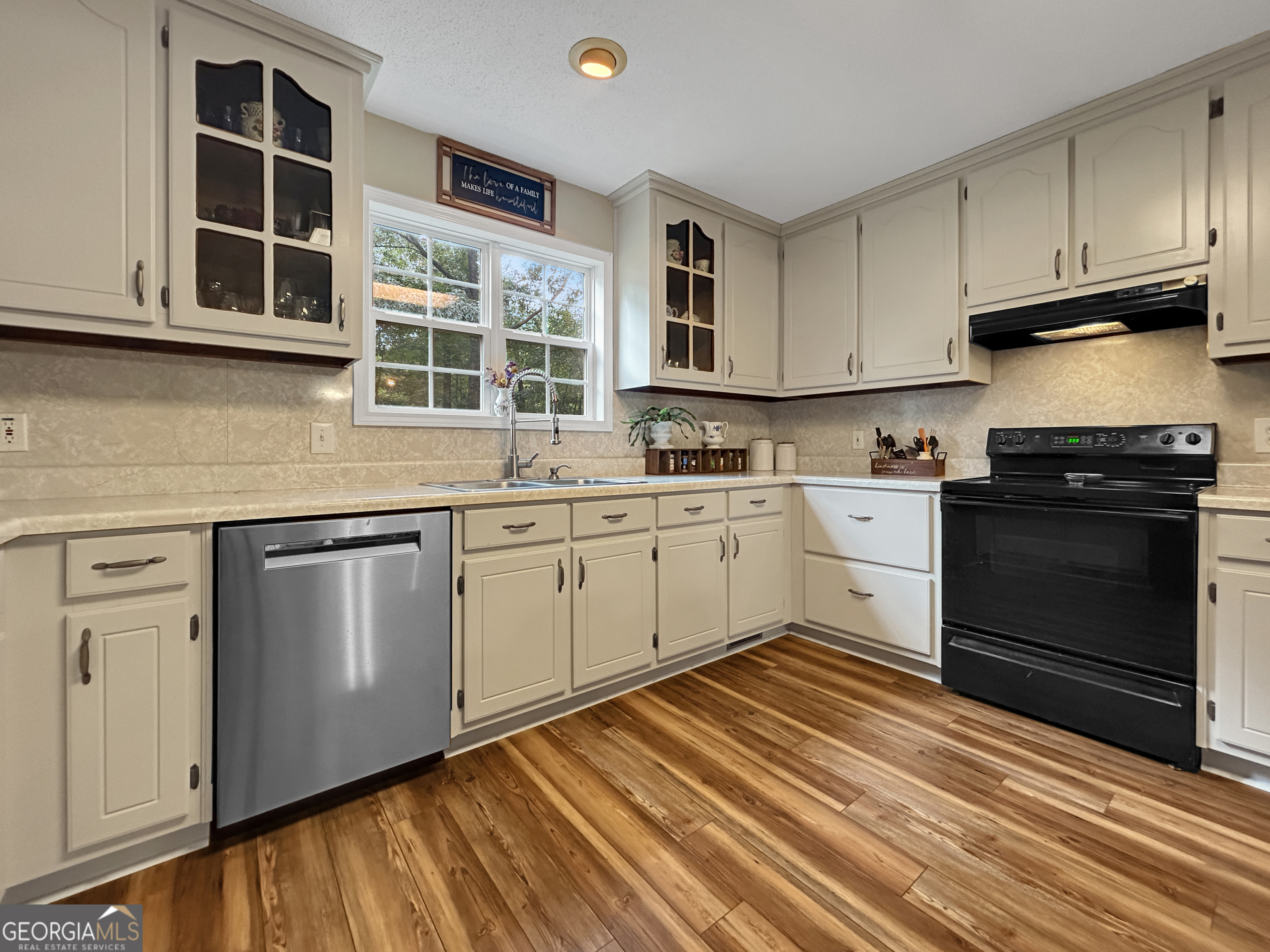 715 Frog Road Locust Grove, GA 30248 - Photo 15 of 56 a kitchen with stainless steel appliances granite countertop a sink and cabinets