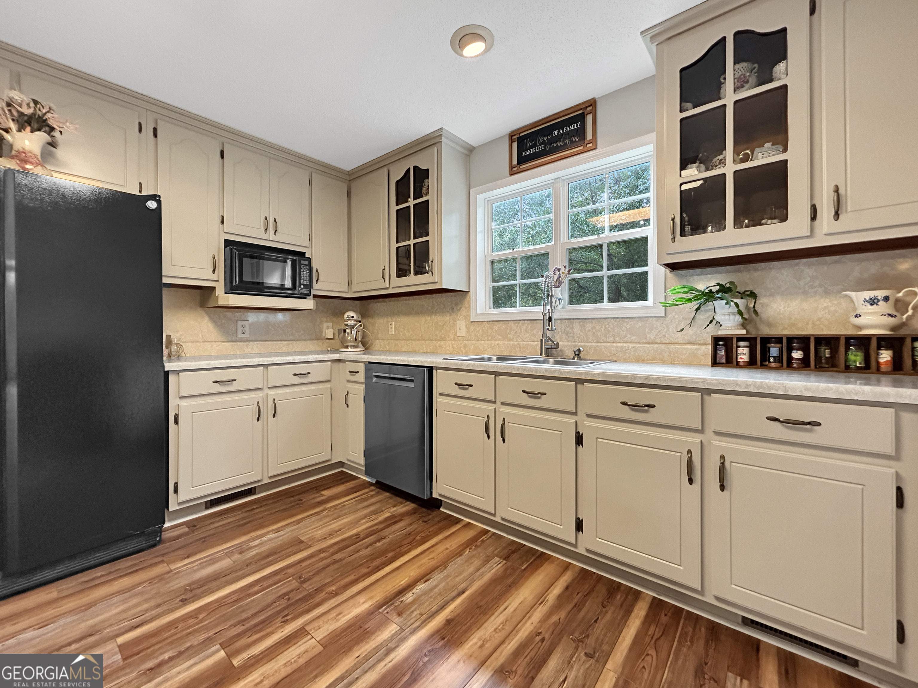 715 Frog Road Locust Grove, GA 30248 - Photo 16 of 56 a kitchen with cabinets stainless steel appliances and a window