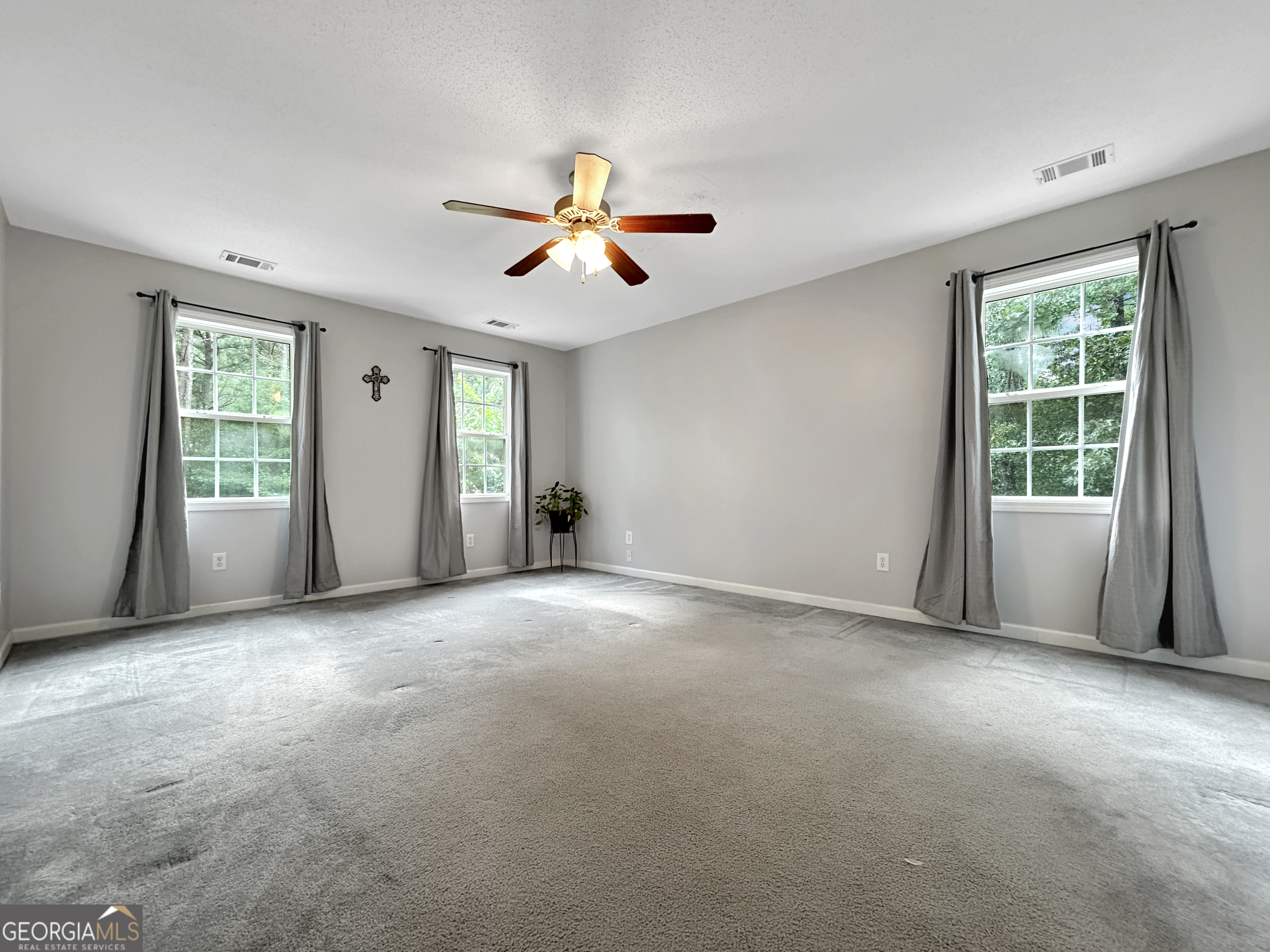 715 Frog Road Locust Grove, GA 30248 - Photo 22 of 56 a view of empty room with windows