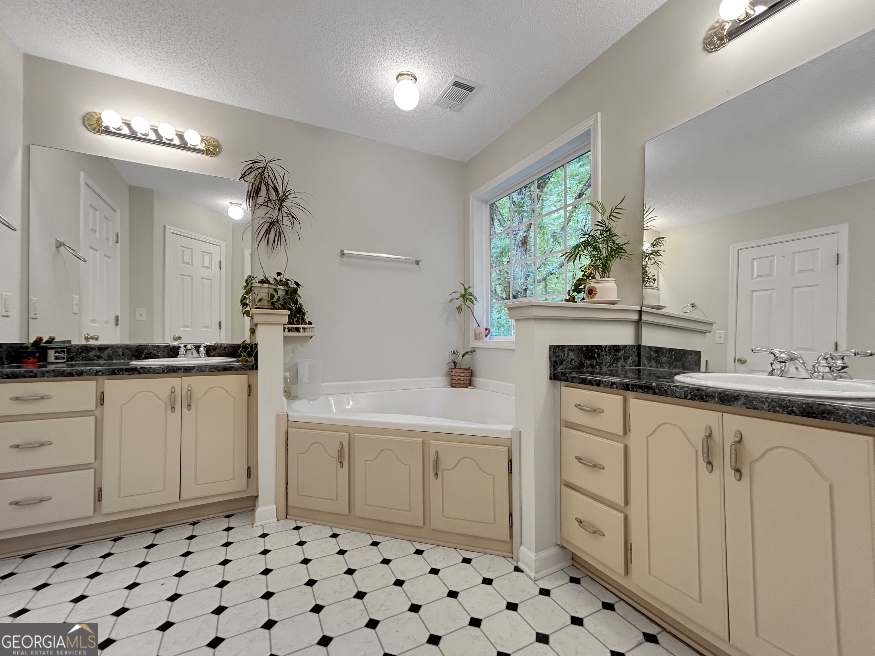 715 Frog Road Locust Grove, GA 30248 - Photo 26 of 56 a kitchen with a sink and cabinets