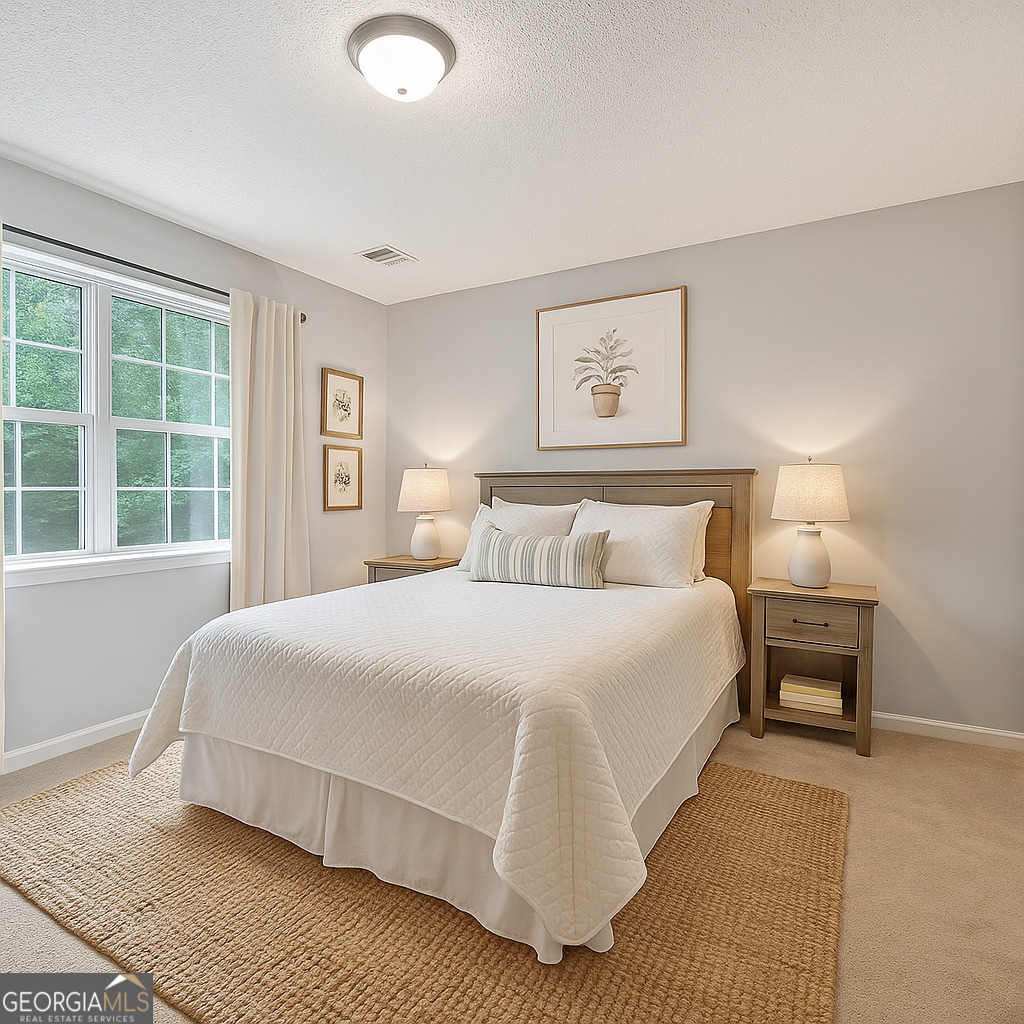 715 Frog Road Locust Grove, GA 30248 - Photo 32 of 56 a bedroom with a bed and window