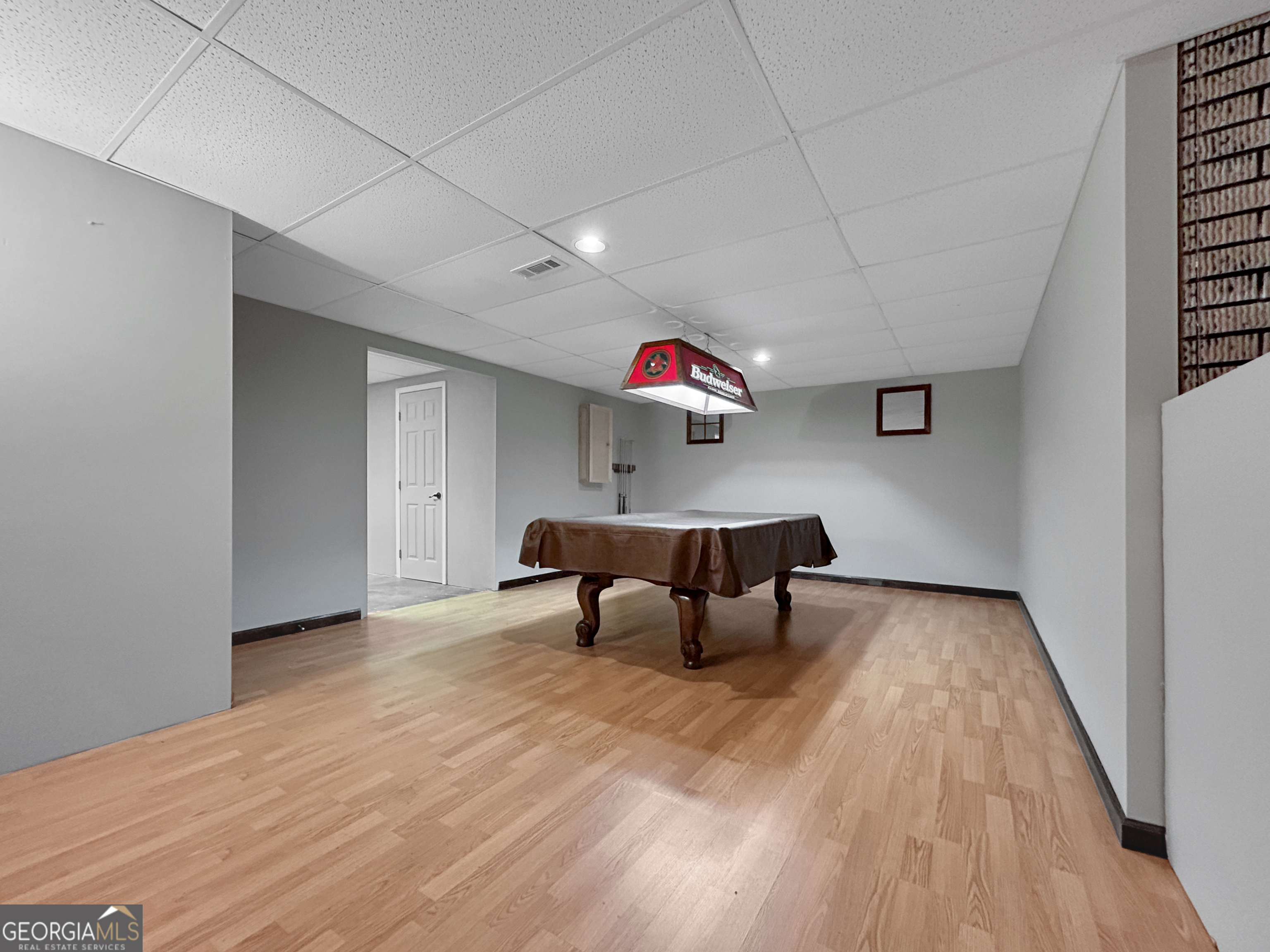 715 Frog Road Locust Grove, GA 30248 - Photo 34 of 56 a living room with furniture and a wooden floor