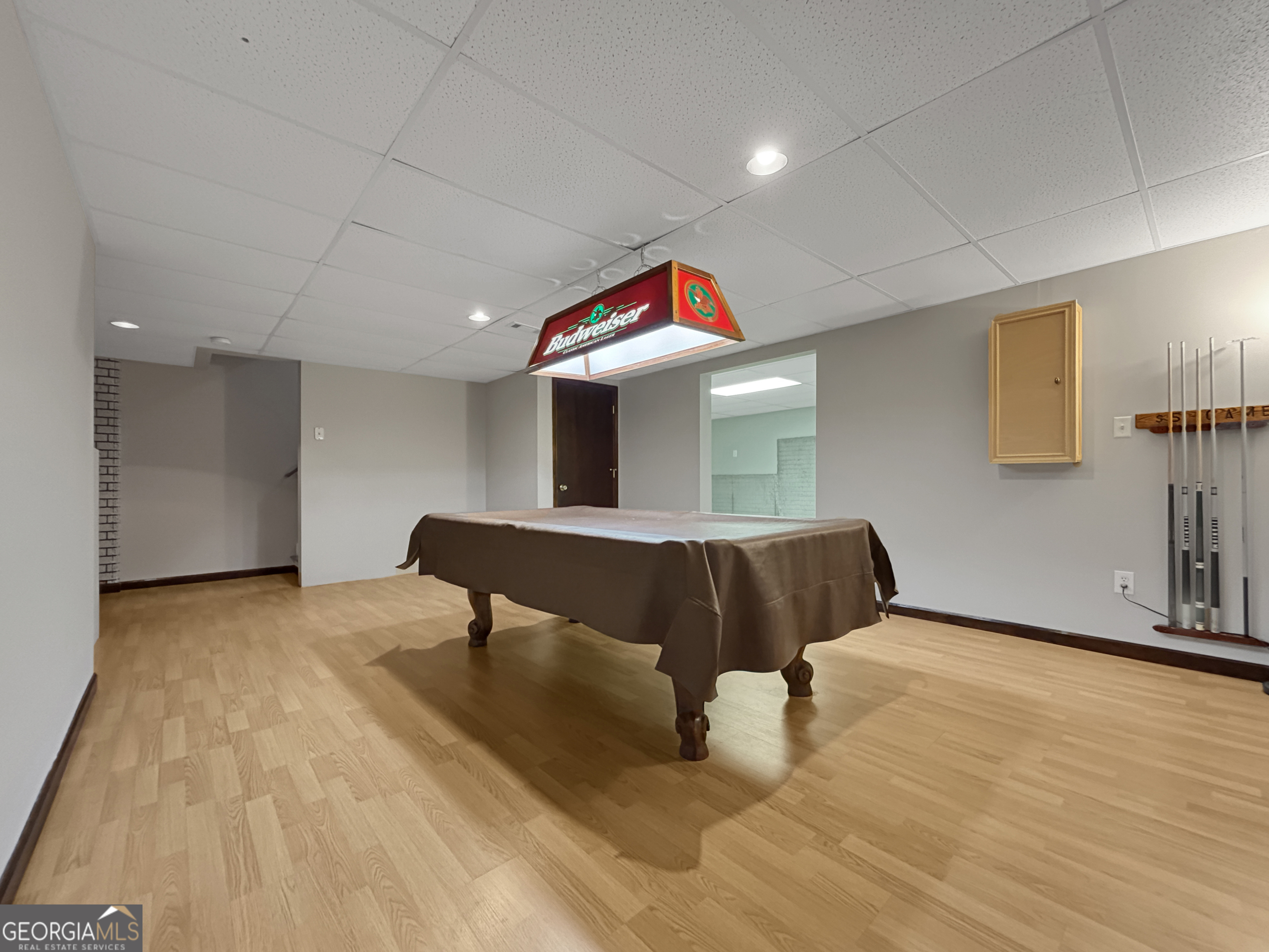 715 Frog Road Locust Grove, GA 30248 - Photo 36 of 56 a living room with furniture and a wooden floor