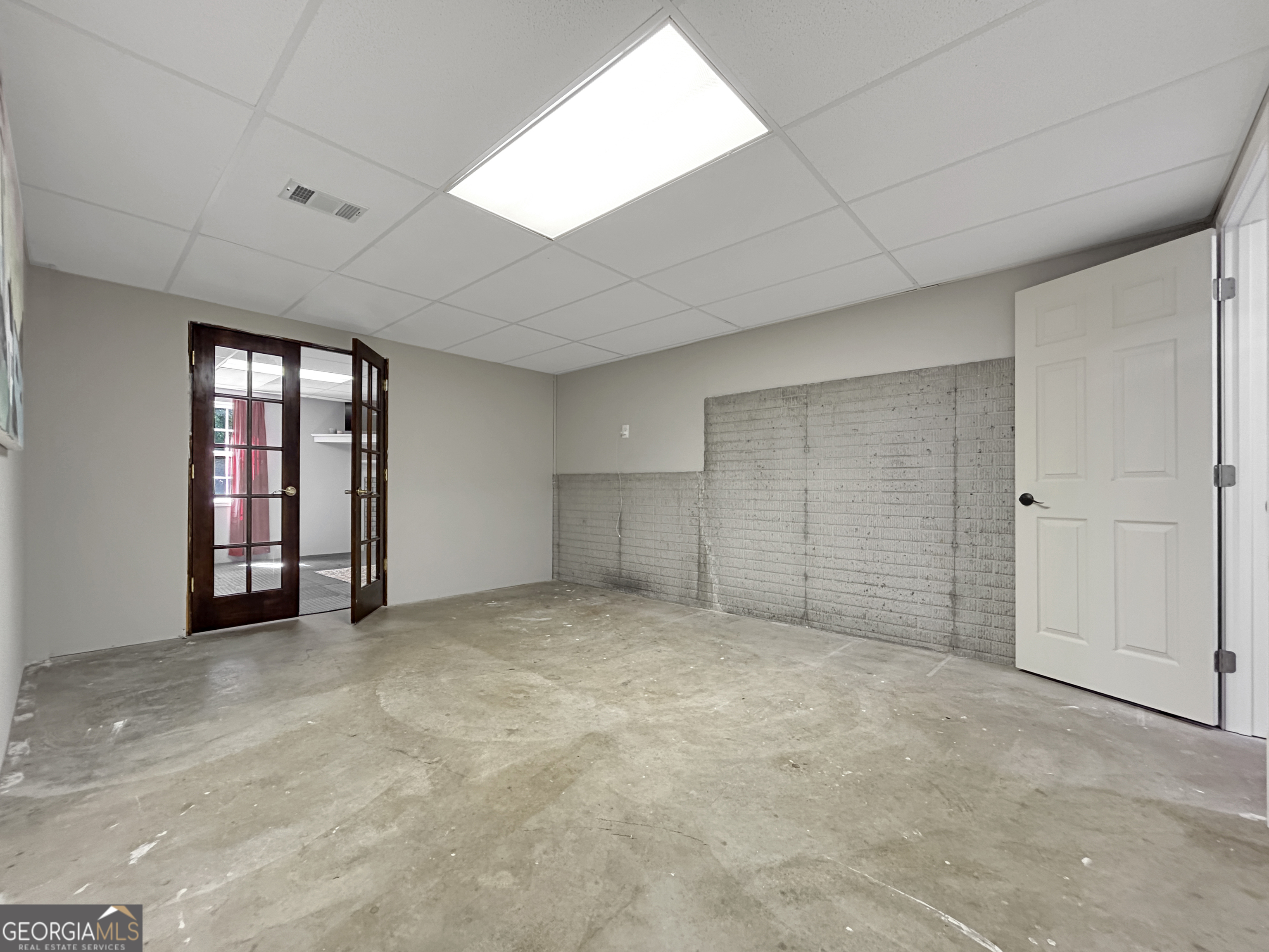 715 Frog Road Locust Grove, GA 30248 - Photo 42 of 56 an empty room with windows