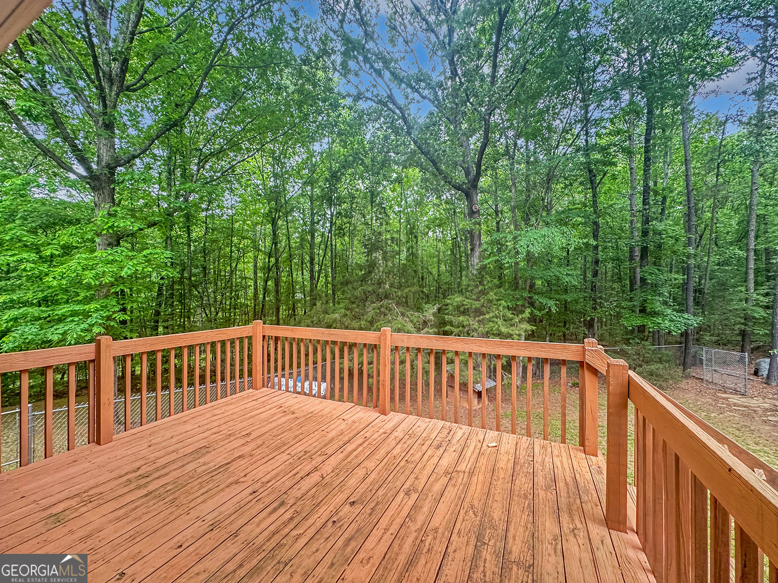 715 Frog Road Locust Grove, GA 30248 - Photo 45 of 56 a view of wooden deck and a garden