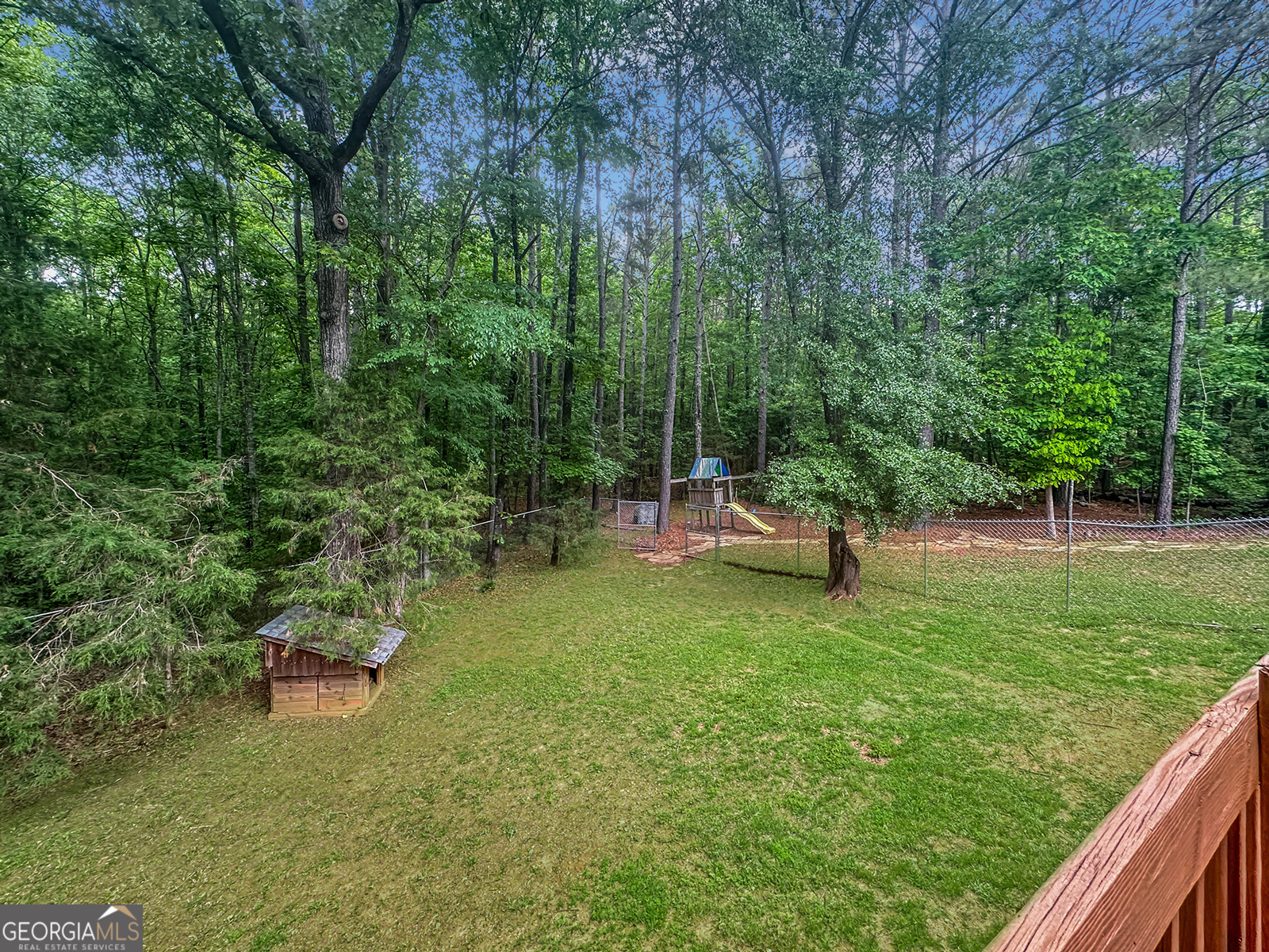 715 Frog Road Locust Grove, GA 30248 - Photo 46 of 56 a backyard of a house with table and chairs
