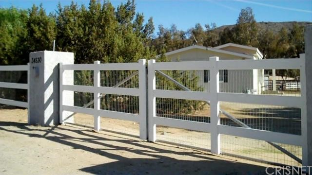34530 Red Rover Mine Road Acton, CA 93510 - Photo 1 of 1 Gated Entry and White Rail Fencing